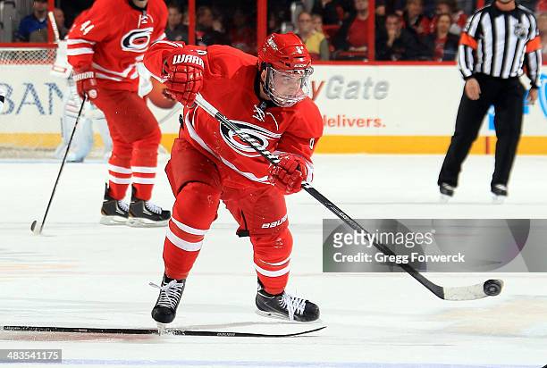 Andrei Loktionov of the Carolina Hurricanes gains control of the puck on the ice during their NHL game against the Dallas Stars at PNC Arena on April...