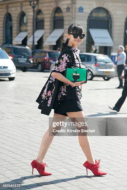 Leaf Greener wears Romance was Born, Loewe bag and AM eyewear sunglasses on day 2 of Paris Fashion Week Haute Couture Autumn/Winter 2015 on July 6,...