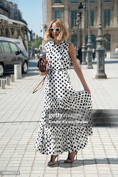 Fashion Blogger Candela Novembre wears an Antonio Marras dress, Sergio Rossi shoes, MSGM bag and Spektre sunglasses on day 2 of Paris Fashion Week...