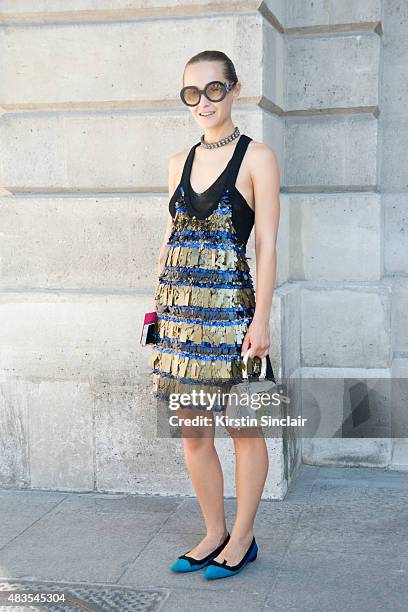 Creative Director of Mercedes-Benz Kiev Daria Shapovalova wears a Sonia Rykiel dress, a Kkye bag, Miu Miu sunglasses and Prada shoes on day 2 of...