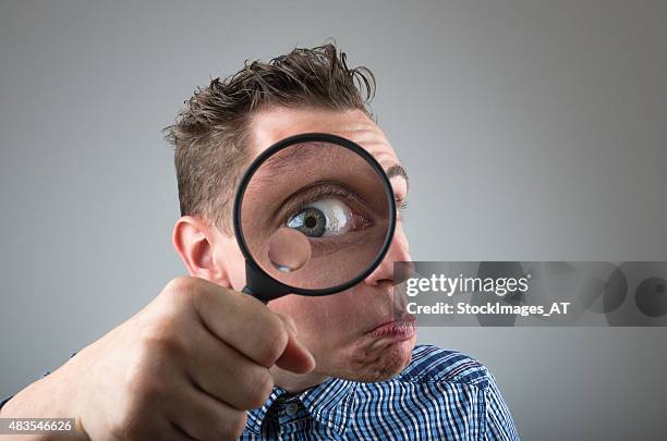 crazy nerd student or professor with magnifier - crazy professor stockfoto's en -beelden