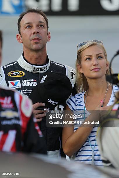 Sprint Cup Series crew chief Chad Knaus and his girlfriend Brooke Werner stand on pit road during the National Anthem prior to the start of the...