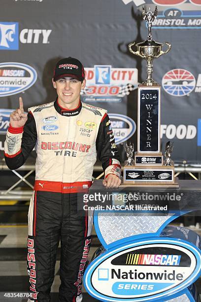 Ryan Blaney, driver of the Discount Tire Ford Mustang, celebrates in victory lane after winning the NASCAR Nationwide Series Food City 300 at the...