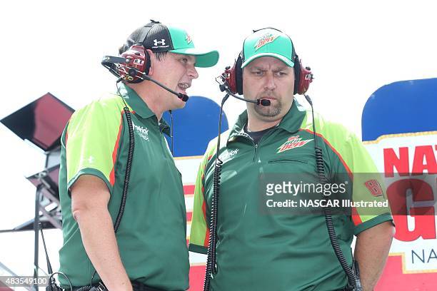 Steve Letarte , crew chief for the Diet Mountain Dew Chevy SS driven by Dale Earnhardt Jr., talks with a crew member during practice for the NASCAR...