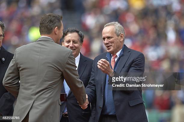 Boston Red Sox President and CEO Larry Lucchino shaking hands with general manager Ben Cherington before game vs Milwaukee Brewers at Fenway Park....