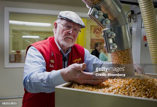 Bob Moore, founder of Bob's Red Mill and Natural Foods, inspects grains at the company's facility in Milwaukie, Oregon, U.S., on Tuesday, April 8,...