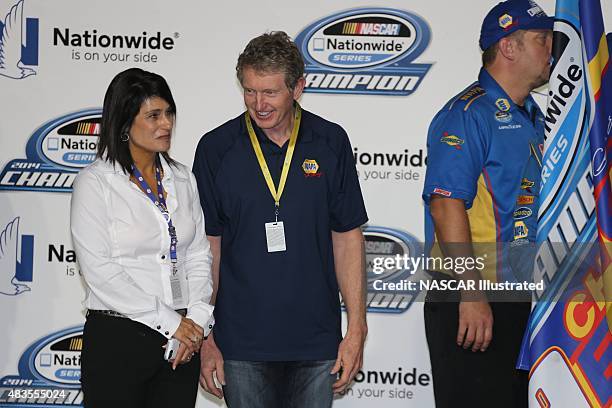 Bill and Cindy Elliott celebrate in victory lane with their son Chase Elliott, driver of the NAPA Auto Parts Chevy Camaro, after winning the 2014...