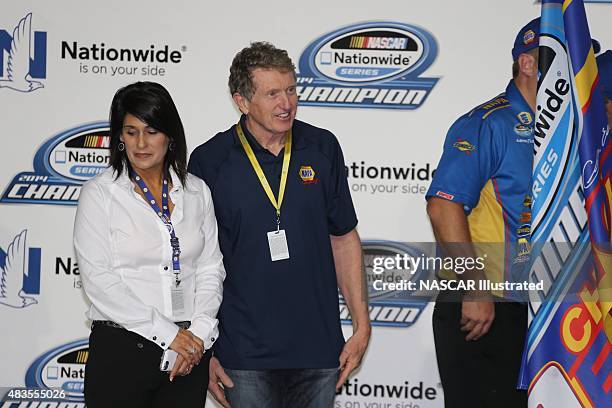 Bill and Cindy Elliott celebrate in victory lane with their son Chase Elliott, driver of the NAPA Auto Parts Chevy Camaro, after winning the 2014...