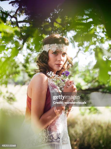 boho girl surrounded by leaves in a summer park - gypsy girl stock pictures, royalty-free photos & images