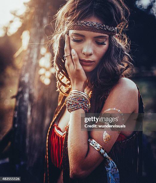 hippie girl outdoors with jewelry and temporary gold foil tattoo - hippie bildbanksfoton och bilder