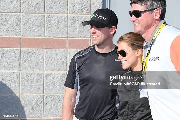 Jordan Fish poses for a photo with boyfriend Denny Hamlin before the start of the Better Half Dash at the Charlotte Motor Speedway in Concord, NC....