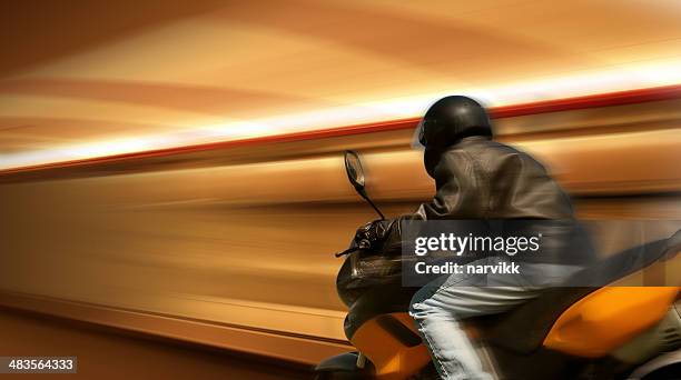 motorbike rider in motion - motorcycle racing stock pictures, royalty-free photos & images