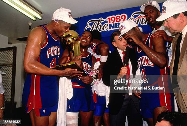 Rick Mahorn of the Detroit Pistons celebrates with his teamates in the locker room after winning the 1989 NBA Finals against the Los Angeles Lakers...