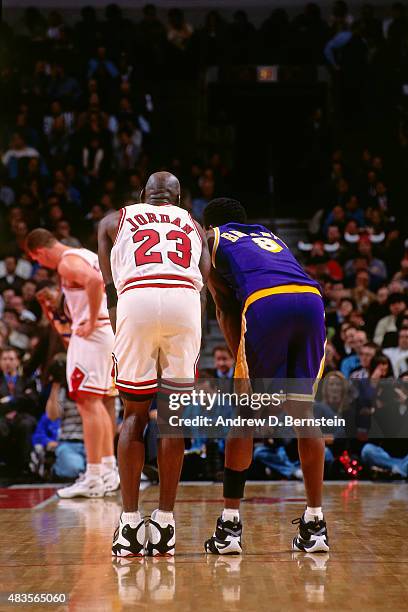 Michael Jordan of the Chicago Bulls stands on the court during a game against Kobe Bryant of the Los Angeles Lakers on December 17, 1997 at Chicago...