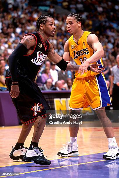 Allen Iverson of the Philadelphia 76ers guards his position against Tyronn Lue of the Los Angeles Lakers on June 6, 2001 at STAPLES Center in Los...