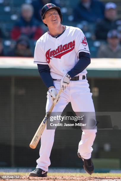 Elliot Johnson of the Cleveland Indians reacts after watching strike three during the first inning against the San Diego Padres in the second game of...