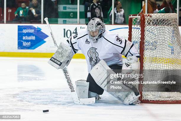 Anthony Brodeur of the the Gatineau Olympiques makes a save against the Rouyn Noranda Huskies during the QMJHL game on March 15, 2014 at Robert...