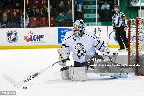 Anthony Brodeur of the the Gatineau Olympiques reaches for the puck with his stick against the Rouyn Noranda Huskies during the QMJHL game on March...