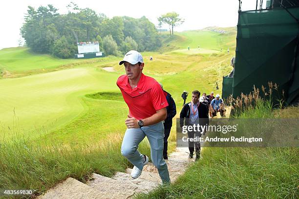 Rory McIlroy of Northern Ireland walks up a set of stairs after a practice round prior to the 2015 PGA Championship at Whistling Straits on on August...