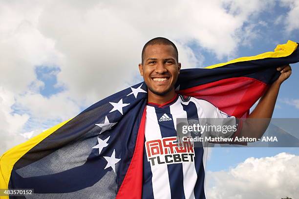 In this image released on August 10 Jose Salomon Rondon poses with the flag of Venezuela as he is unveiled by West Bromwich Albion at West Bromwich...