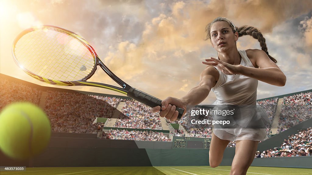 Female Tennis Player About To Strike Ball