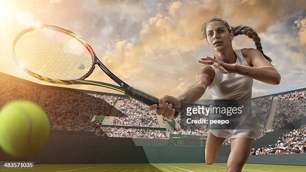female tennis player about to strike ball - wimbledon tennis stock pictures, royalty-free photos & images