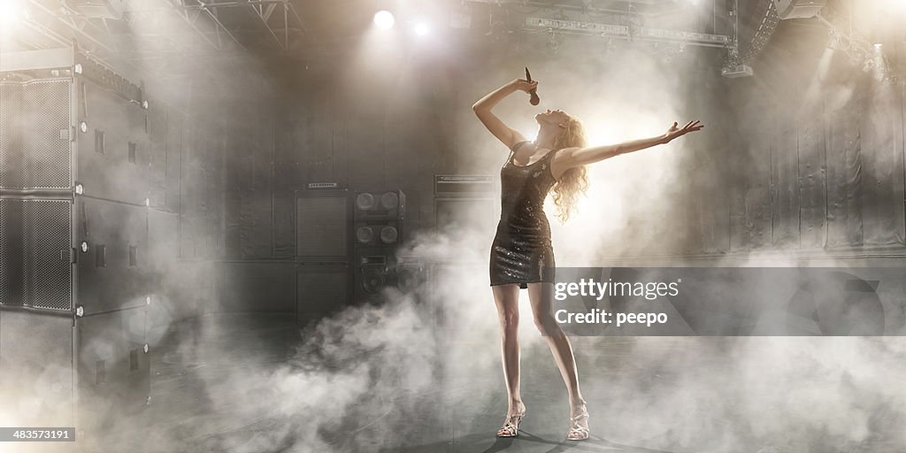 Attractive Singer Performing on Stage