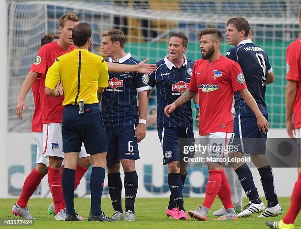 Sebastian Langkamp, Tom Schuetz and Christian Mueller, Marvin Plattenhardt of Hertha BSC and Fabian Klos of Arminia Bielefeld during the match...