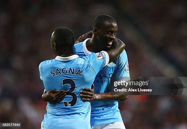 Yaya Toure of Manchester City celebrates with team mate Bacary Sagna as he scores their second goal during the Barclays Premier League match between...