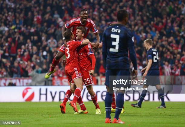 Thomas Mueller of Bayern Muenchen celebrates scoring his team's second goal with team mates during the UEFA Champions League Quarter Final second leg...