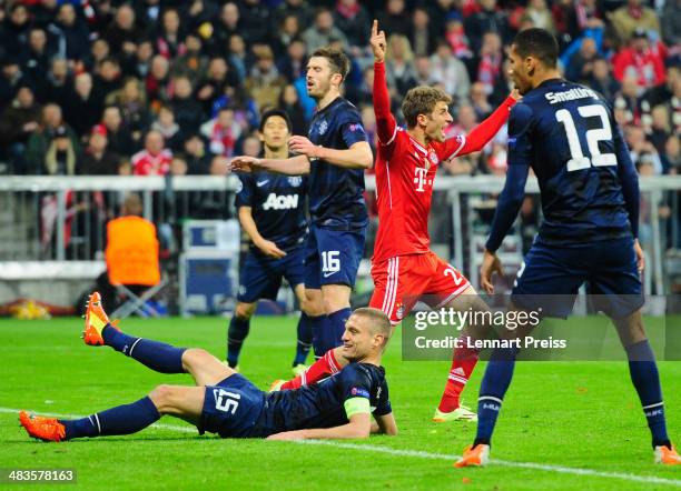 Thomas Mueller of Muenchen celebrates after scores his teams second goal during the UEFA Champions League quarter-final second leg match between FC...