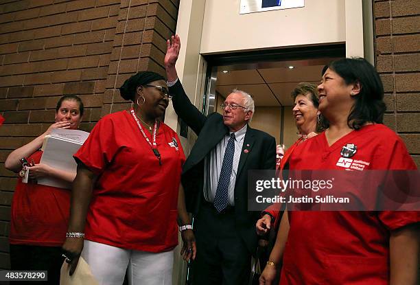 Independent presidential candidate U.S. Sen. Bernie Sanders waves to nurses as he arrives at a "Brunch with Bernie" campaign rally at the National...