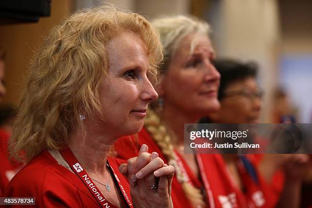 Nurses with the National Nurses United looks on as Independent presidential candidate U.S. Sen. Bernie Sanders speaks during the "Brunch with Bernie"...