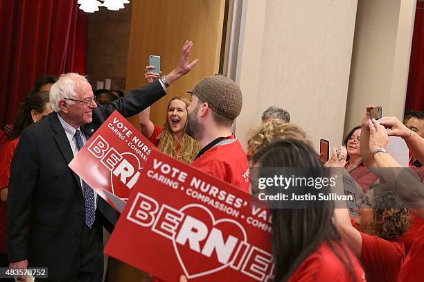 Independent presidential candidate U.S. Sen. Bernie Sanders waves to nurses as he arrives at a "Brunch with Bernie" campaign rally at the National...