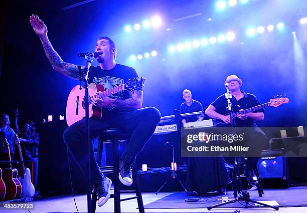 Guitarist Clint Lowery, touring keyboardist Kurt Wubbenhorst, and bassist Vince Hornsby of Sevendust perform during an acoustic concert at the...
