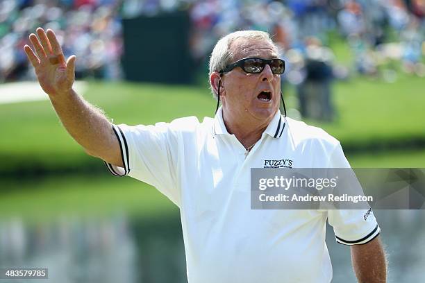 Fuzzy Zoeller waves to the gallery during the 2014 Par 3 Contest prior to the start of the 2014 Masters Tournament at Augusta National Golf Club on...