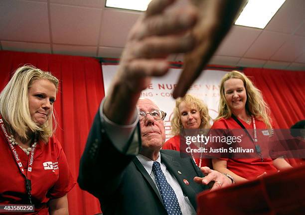 Independent presidential candidate U.S. Sen. Bernie Sanders shakes hands with a nurses from the National Nurse United during a "Brunch with Bernie"...