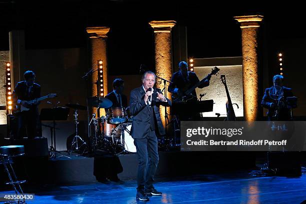 Humorist Michel Leeb performs in his 'Michel Leeb Part en Live !' show, accompanied by the music band 'The Messangers', during the 31th Ramatuelle...