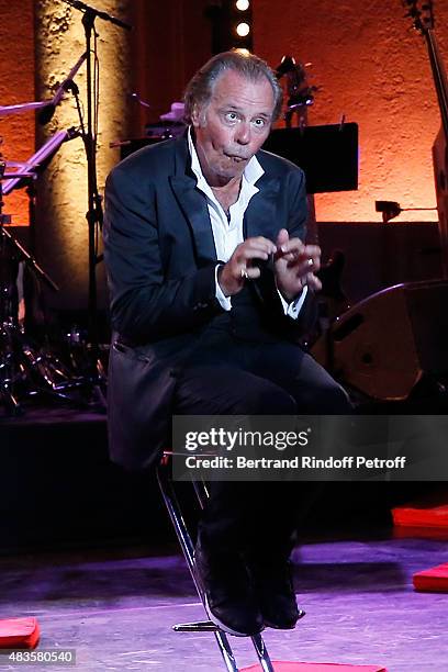 Humorist Michel Leeb performs in his 'Michel Leeb Part en Live !' show, accompanied by the music band 'The Messangers', during the 31th Ramatuelle...