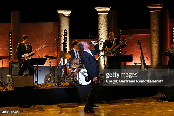 Humorist Michel Leeb performs in his 'Michel Leeb Part en Live !' show, accompanied by the music band 'The Messangers', during the 31th Ramatuelle...