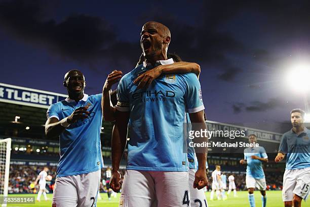 Vincent Kompany of Manchester City celebrates as he scores their third goal during the Barclays Premier League match between West Bromwich Albion and...