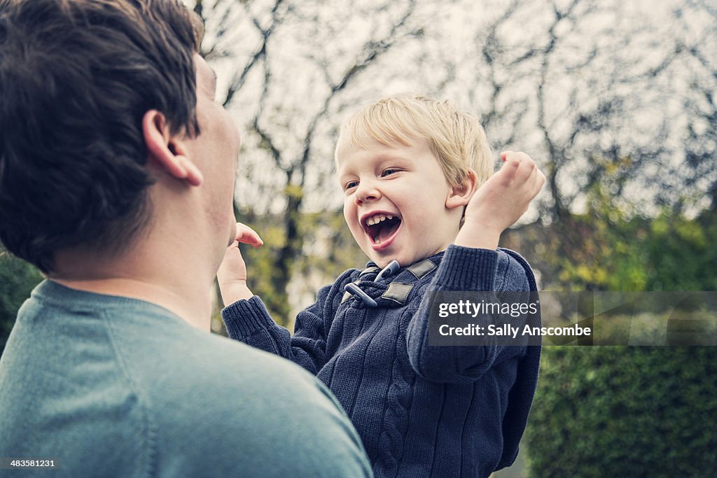 Father and son laughing together