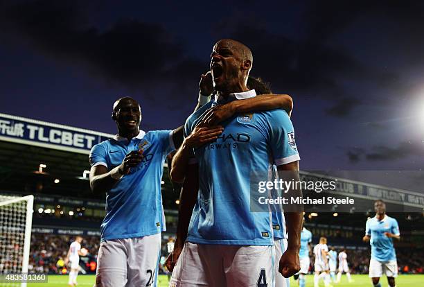 Vincent Kompany of Manchester City celebrates as he scores their third goal during the Barclays Premier League match between West Bromwich Albion and...