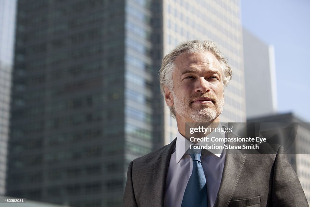 Portrait of businessman in city