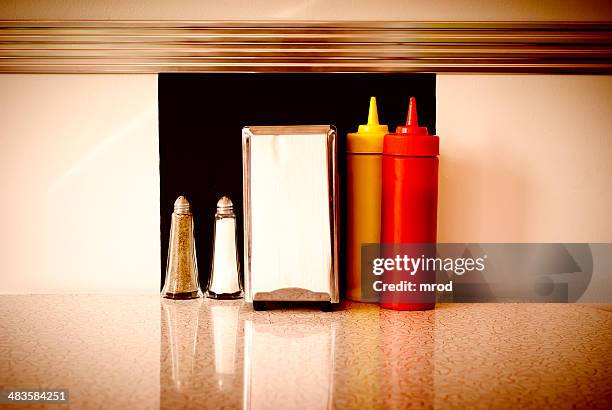 table in a diner - pepper pot stock pictures, royalty-free photos & images