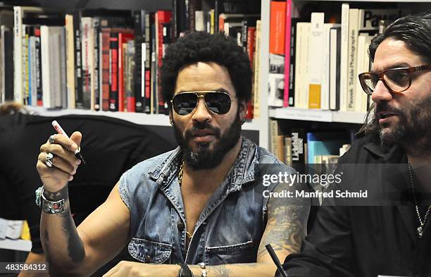 Lenny Kravitz signs signatures for fans during the opening of Flash by Lenny Kravitz exhibition at Ostlicht Gallery on August 10, 2015 in Vienna,...