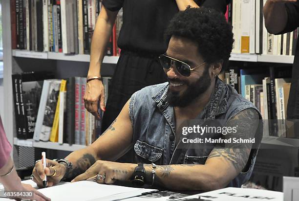 Lenny Kravitz signs signatures for fans during the opening of Flash by Lenny Kravitz exhibition at Ostlicht Gallery on August 10, 2015 in Vienna,...