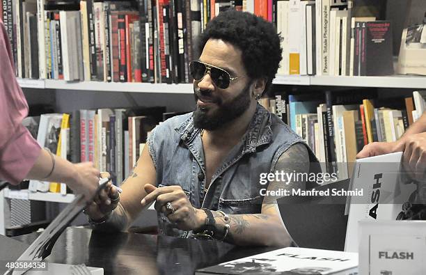 Lenny Kravitz signs signatures for fans during the opening of Flash by Lenny Kravitz exhibition at Ostlicht Gallery on August 10, 2015 in Vienna,...