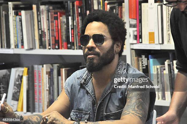 Lenny Kravitz signs signatures for fans during the opening of Flash by Lenny Kravitz exhibition at Ostlicht Gallery on August 10, 2015 in Vienna,...