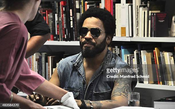 Lenny Kravitz signs signatures for fans during the opening of Flash by Lenny Kravitz exhibition at Ostlicht Gallery on August 10, 2015 in Vienna,...